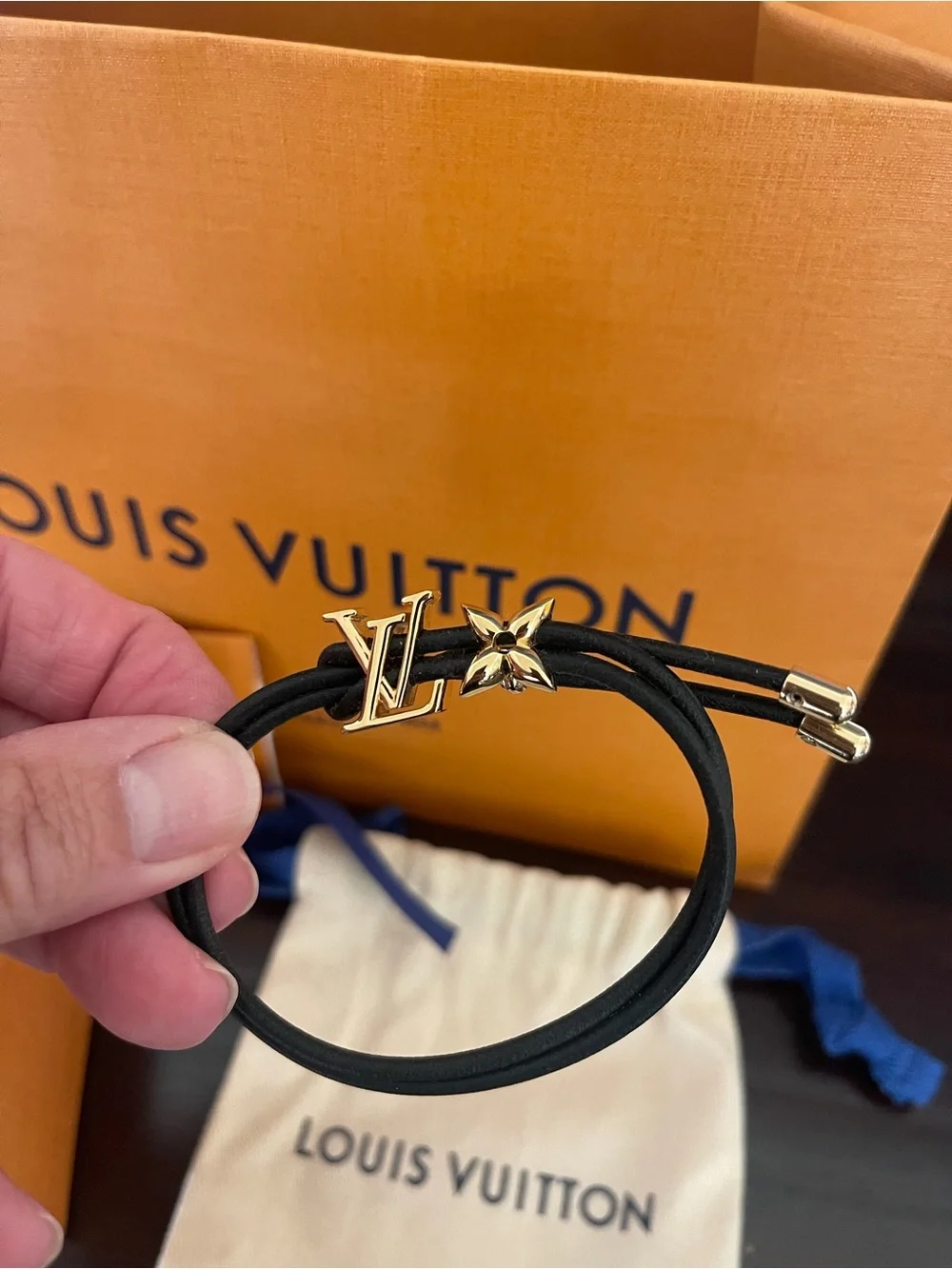 Louis Vuitton Blossom Black Cord Bracelet with Gold LV and Flower. Adjustable.